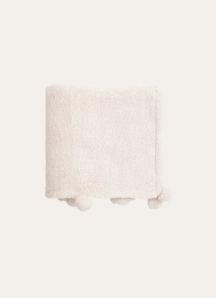 PLAID EN SHERPA AVEC FINITIONS POMPONS ÉCRU