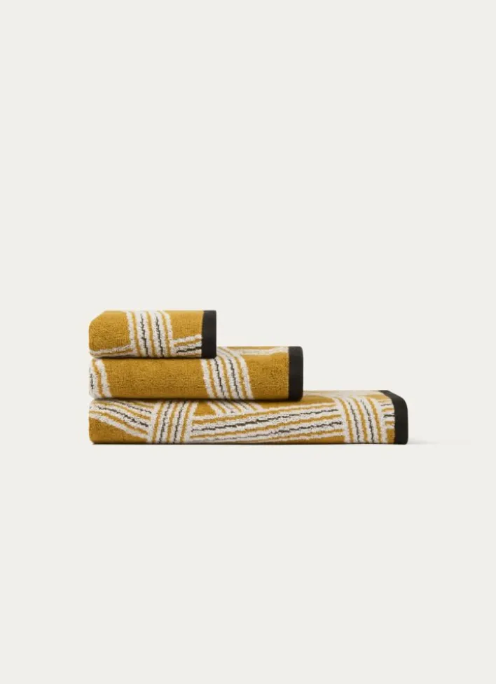 SERVIETTE DE TOILETTE JACQUARD MOTIFS GÉOMÉTRIQUES JAUNE OCRE