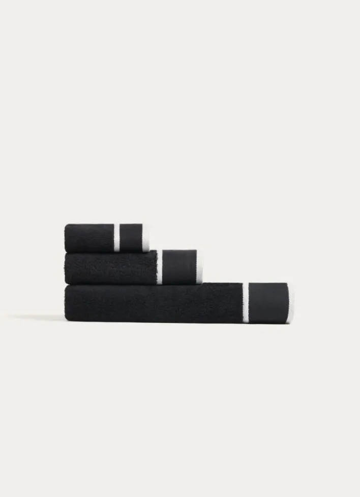 SERVIETTE DE TOILETTE UNIE À LARGE BORDURE ARTHUR NOIR